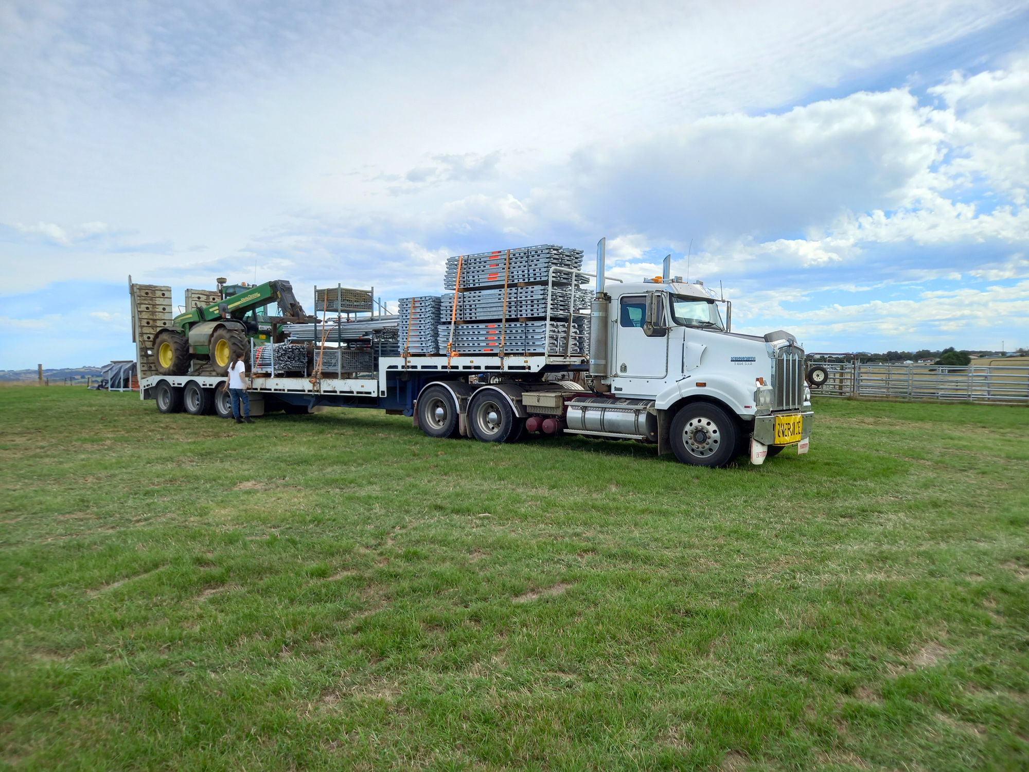 Leongatha based business Scaffdex loading a truck with scaffolding and  telehandler ready to transport to jobsite. 